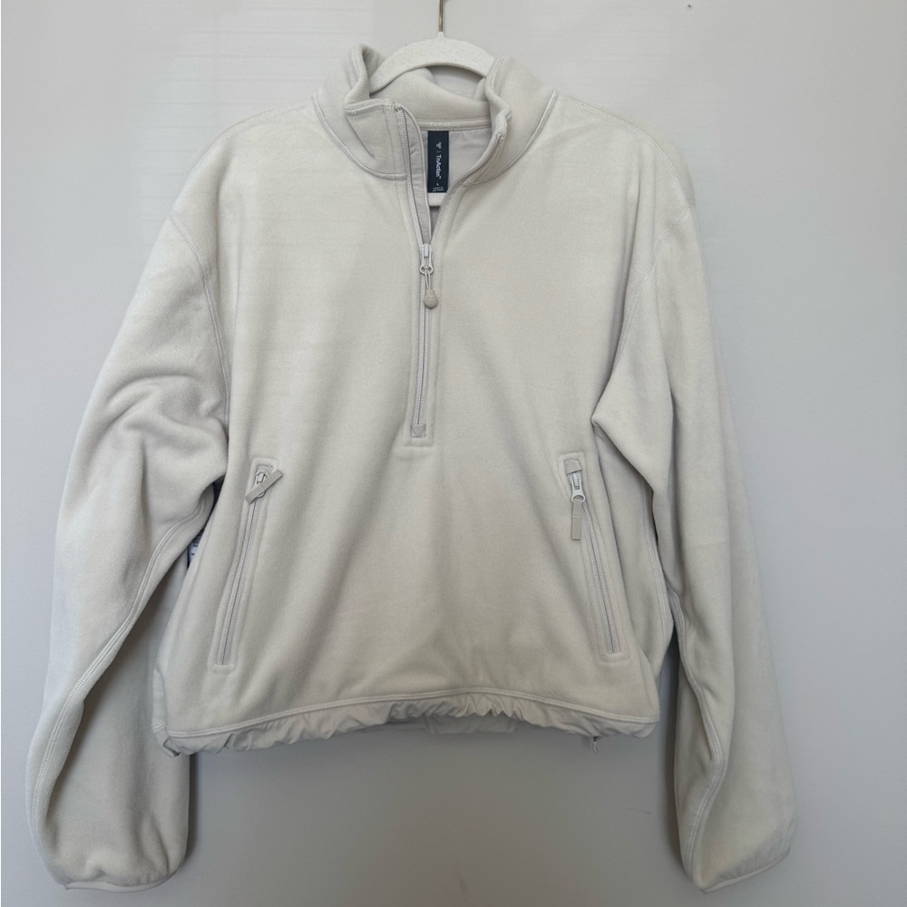 TNA action sweater
